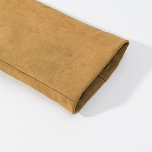 Detail of tan faux suede jacket sleeve cuff with precision stitching and snap button