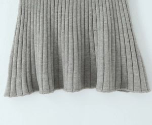 Close-up of the grey ribbed knit fabric showing the vertical texture and thick material