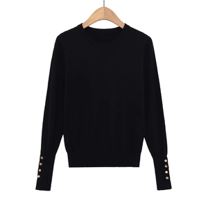 Women's black crew neck knit top with stylish gold buttons on sleeves and ribbed cuffs