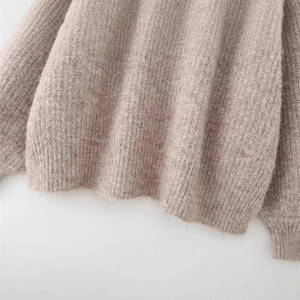 Oatmeal knit sweater features a cozy turtleneck and premium fuzzy wool texture material