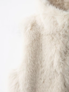 Close-up detail of soft faux fur texture on a beige sleeveless vest for women