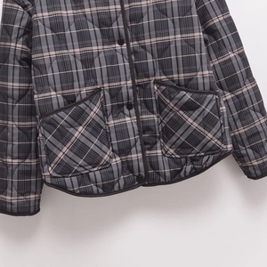 Quilted plaid cotton coat with round neck and black trim pockets in grey and beige