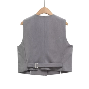 Detail of grey suit vest back with adjustable strap and metallic silver buckle