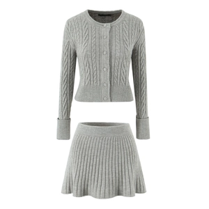 Gray cable knit two-piece set featuring a short buttoned cardigan and pleated mini skirt