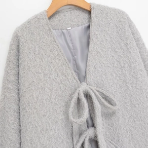 Fashionable grey long-sleeved plush coat with V-neckline and bow-tie front closure