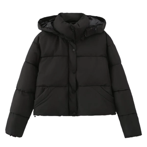 Detail shot of the quilted padding and metallic snap buttons on this black hooded puffer jacket