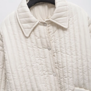Women's cream quilted jacket with heart-shaped silver buttons and stylish turn-down collar