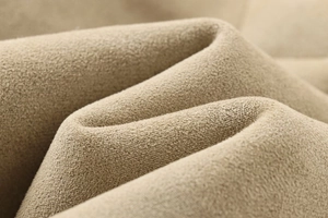 Macro de la textura de tela de microgamuza caqui con ondas suaves y acabado mate