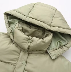 Women's stylish bean green hooded quilted jacket with adjustable drawstrings and snaps