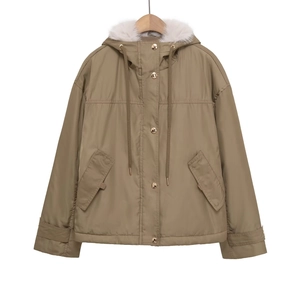 Detail of winter jacket with faux fur hood, gold metal snaps and large cargo pockets