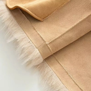 Macro detail of camel faux suede jacket featuring soft plush faux fur lining and stitching
