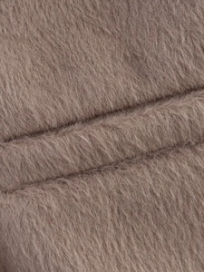 Close-up of the soft plush fabric texture and brown faux fur fibers on this jacket