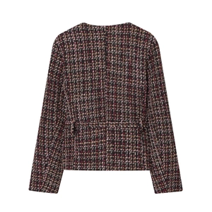 Back view of women's tweed jacket showing intricate pink and black woven texture