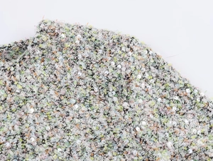 Gros plan sur tissu en tweed à paillettes avec fil coloré et reflets argentés