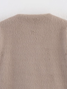 Close-up of soft camel fuzzy fabric texture for women's autumn long sleeve cardigan
