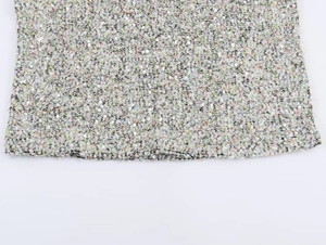 Vue macro détaillée du tissu en tweed avec des fibres colorées et des paillettes