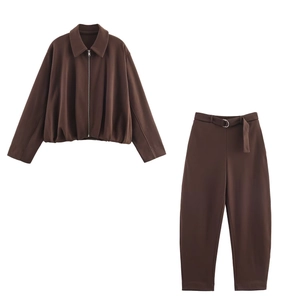 Flat lay of brown two-piece set featuring a zipper bomber jacket and belted cargo pants