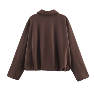Rear view of deep brown oversized bomber jacket with turn-down collar and hem detail