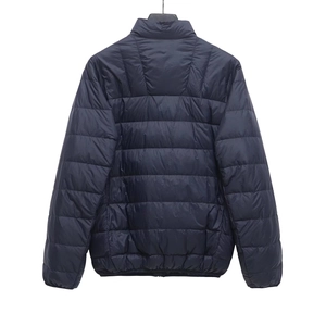 Detail view of the stand-up collar and horizontal quilting on this navy blue jacket