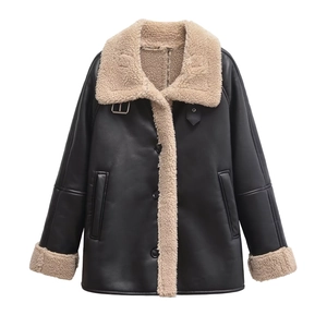 Detail of faux leather shearling jacket with white fur collar and metal buckle accents