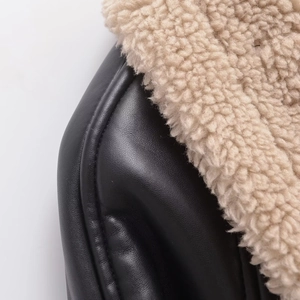 Women's faux leather shearling jacket in black with beige faux fur lining detail