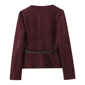 Detail of the burgundy suede jacket back featuring tonal waist strap and central seam