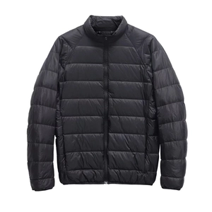 Minimalist black lightweight stand collar quilted jacket with front zipper on white background