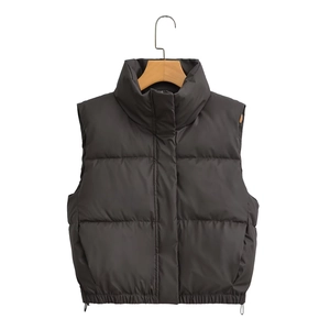 Women's black quilted puffer vest with stand-up collar and adjustable drawstring waist