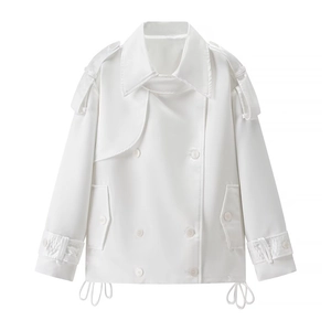 Detail of white double-breasted short trench coat with wide lapels and epaulets