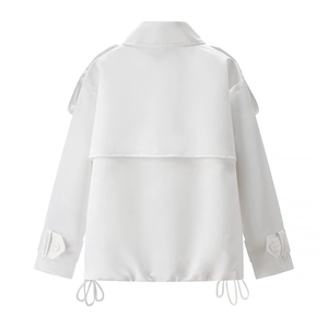 Rear view of white short trench coat featuring storm flap and drawstring hem details