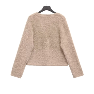 Back view of a luxury faux mink fur knitted cardigan in warm apricot brown with soft texture