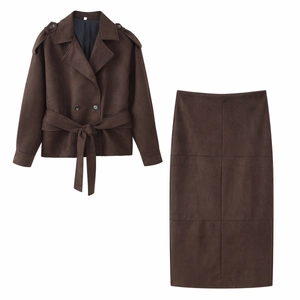 Flat lay of brown faux suede two-piece set featuring short belted jacket and midi skirt