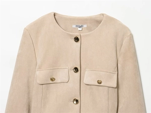 Detail of light beige faux suede jacket showing round collar, buttons and brand label