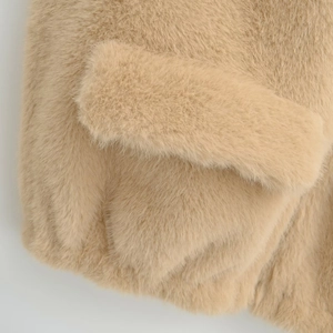 Faux fur vest in camel brown featuring thick soft texture and flap pocket detail