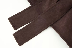 Detail shot of the dark brown suede belt with reinforced stitching for women's skirt set