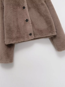 Close-up of faux fur jacket texture with three black buttons on a coffee brown coat