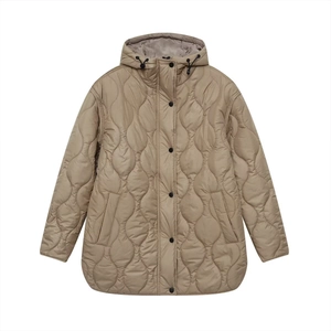 Detail of khaki quilted jacket featuring wavy patterns and contrasting black buttons