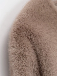Macro shot of high-quality faux fur texture in elegant taupe for winter jackets