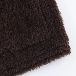 Macro shot showing soft texture of dark coffee faux fur on long sleeve jacket