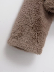 Close-up of the plush taupe faux fur sleeve texture on this elegant round neck jacket