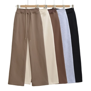 Detailed view of high-waist wide-leg sweatpants in multiple neutral colors with drawstring