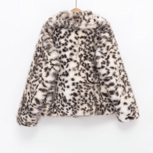Detail showing high-quality leopard print texture on a warm faux fur collar coat