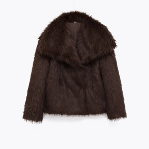 Macro detail of brown faux fur texture and large lapel collar of the stylish winter coat