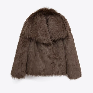 Macro detail of plush faux fur texture on a dark brown lapel collar short jacket