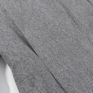 Vue macro de la texture du tissu en laine grise et détails de couture de haute qualité