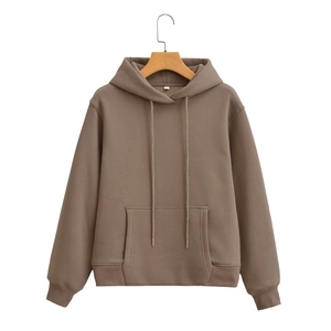 Detail view of brown hoodie with kangaroo pocket and drawstring on a wooden hanger