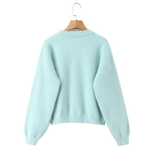 Vue arrière du gilet vert menthe avec texture duveteuse et détails de bord-côte