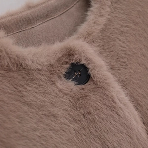Women's faux fur jacket in taupe with round neck and premium matte black button detail
