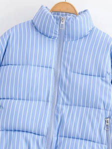 Detail view of blue and white striped quilted jacket with silver metal zipper and high collar