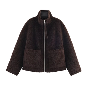 Close-up of deep brown teddy fleece jacket with silver zipper and stand collar detail